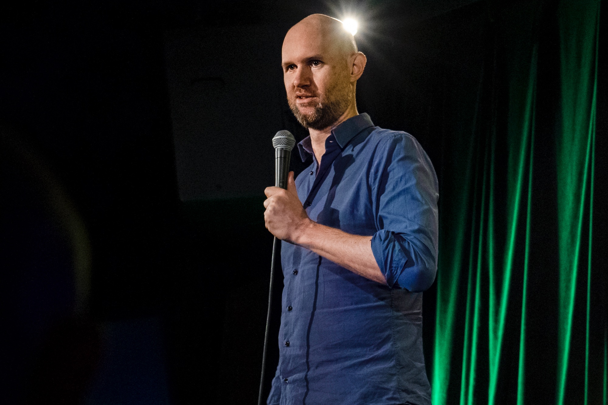 Tom Orr performing stand-up comedy on stage